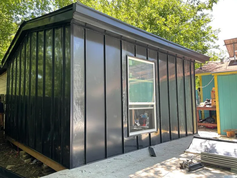 Black standing seam metal wall panels for Metal Roof Installation in Norwich